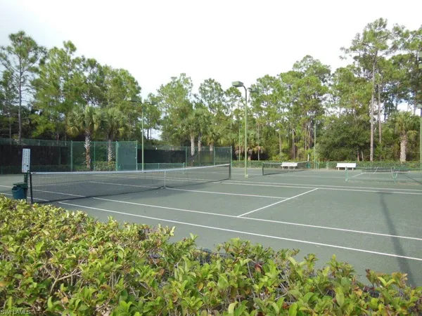 a view of a playground with basketball court