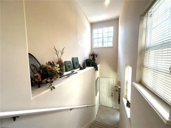 a living room with a couch and a window