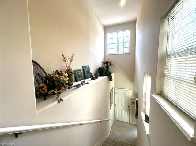 a living room with a couch and a window