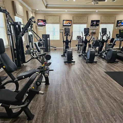 a room with table chairs and wooden floor