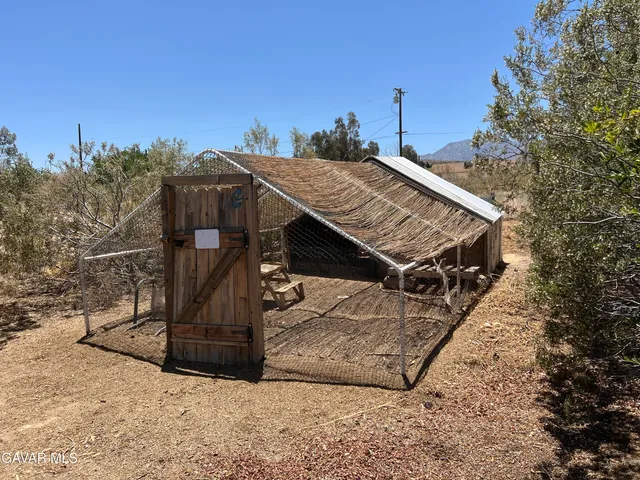 a view of a house with a snow in the background