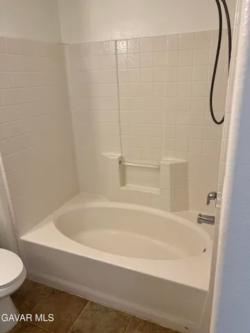 a bathroom with a bath tub