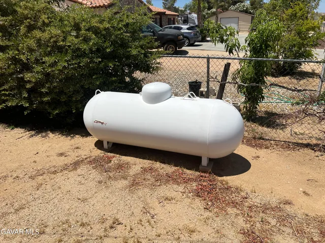 a view of a backyard of the house