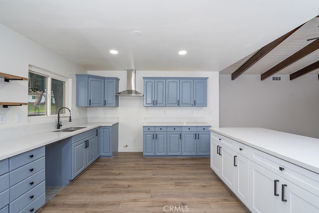 6026 Moraga Avenue Riverside, CA 92509 - Photo 11 of 42 a large kitchen with cabinets