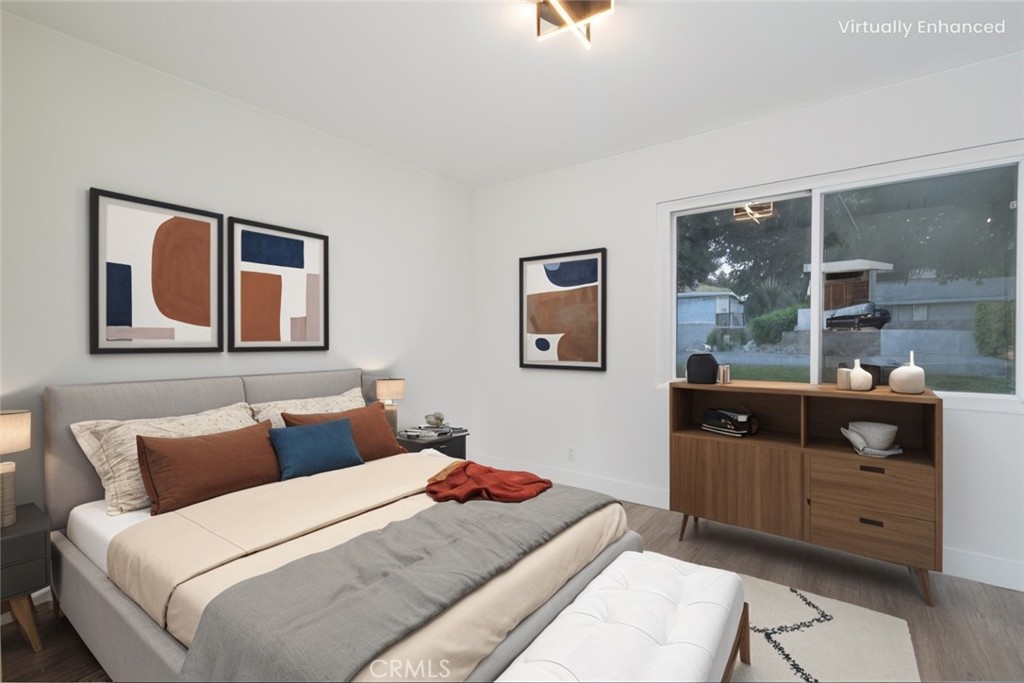 6026 Moraga Avenue Riverside, CA 92509 - Photo 15 of 42 a bedroom with a large bed and a window