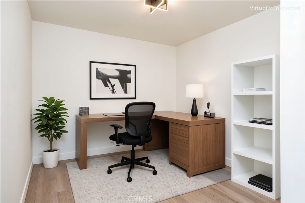 6026 Moraga Avenue Riverside, CA 92509 - Photo 18 of 42 a view of a workspace with furniture and a potted plant