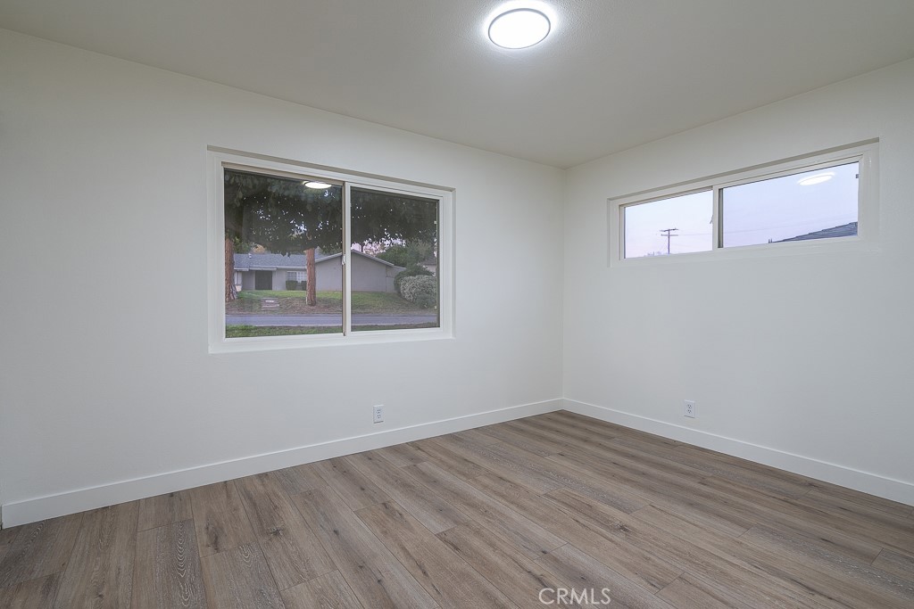 6026 Moraga Avenue Riverside, CA 92509 - Photo 23 of 42 a view of empty room with wooden floor and fan