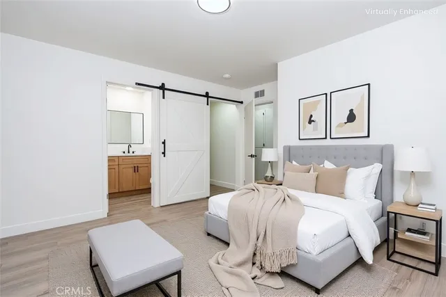 a bedroom with a bed and a couch