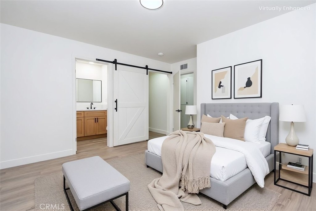 6026 Moraga Avenue Riverside, CA 92509 - Photo 24 of 42 a bedroom with a bed and a couch