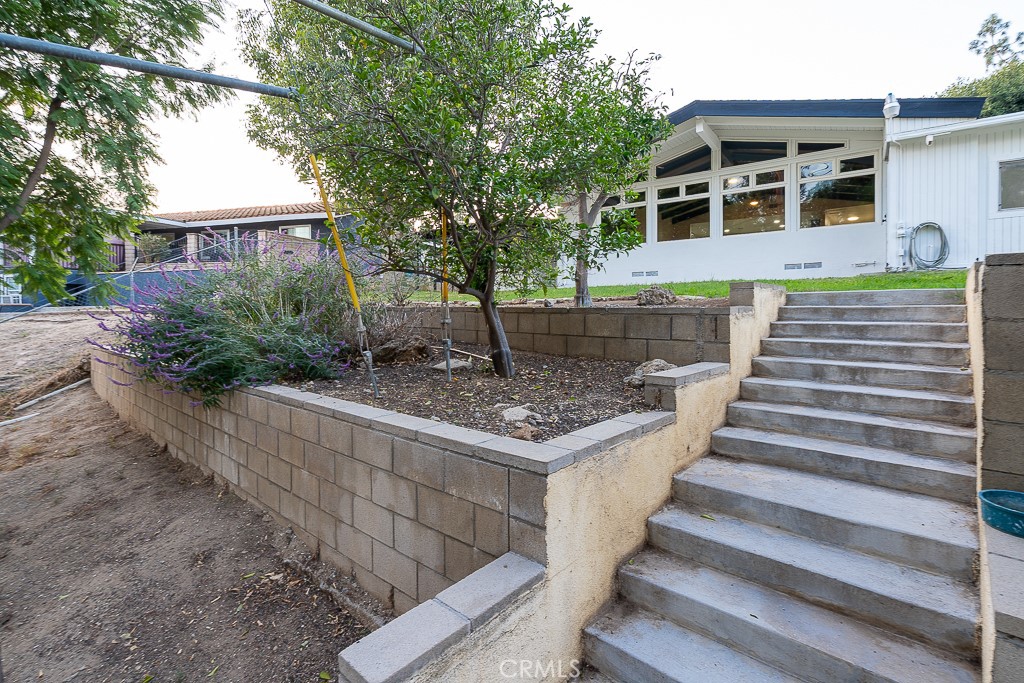6026 Moraga Avenue Riverside, CA 92509 - Photo 30 of 42 a front view of a house with porch