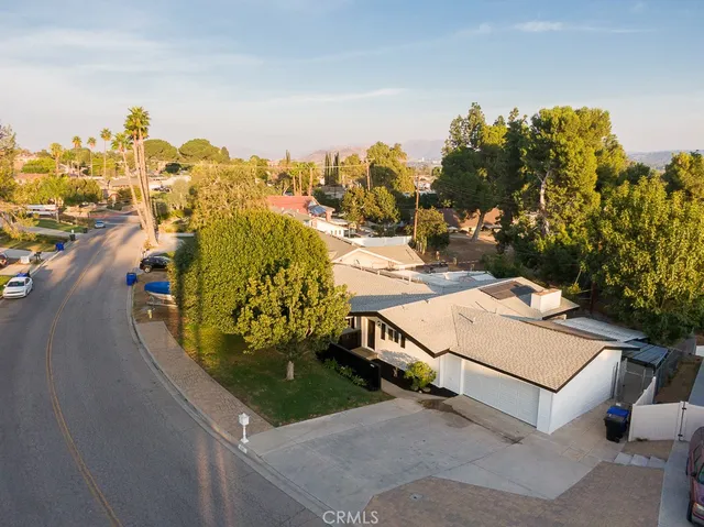 an aerial view of a house with a garden