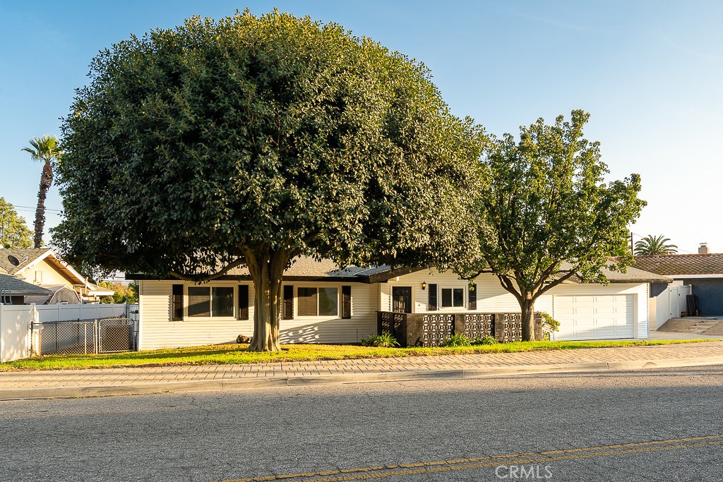 6026 Moraga Avenue Riverside, CA 92509 - Photo 39 of 42 a front view of a house with a yard