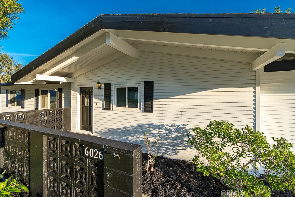 6026 Moraga Avenue Riverside, CA 92509 - Photo 41 of 42 a view of a house with a small yard