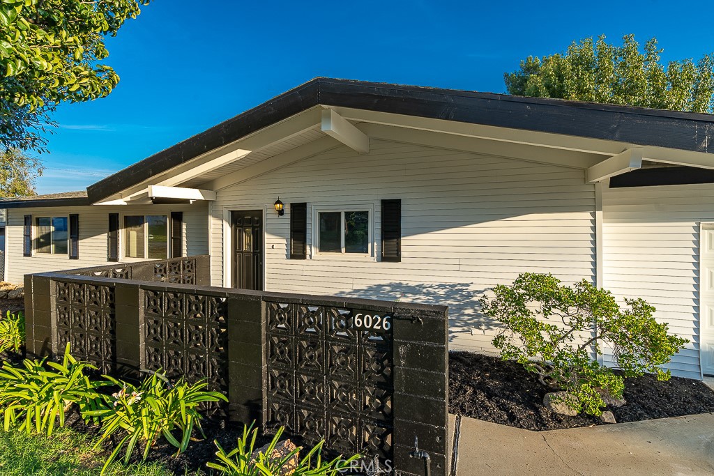 6026 Moraga Avenue Riverside, CA 92509 - Photo 42 of 42 a front view of a house with a garden