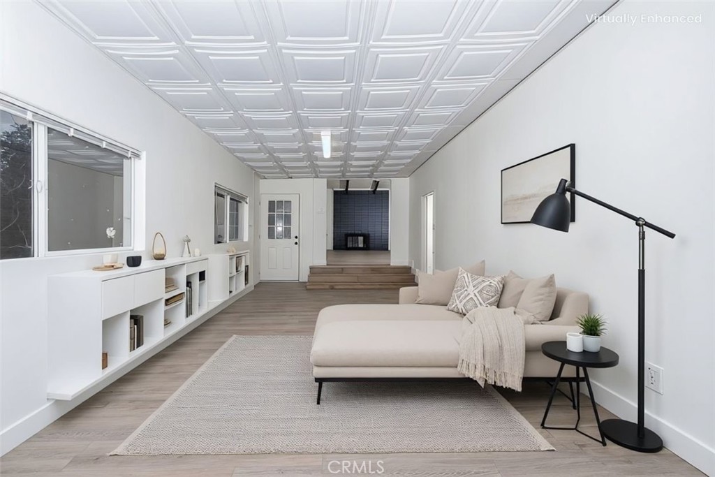 6026 Moraga Avenue Riverside, CA 92509 - Photo 7 of 42 a living room with furniture and a chandelier