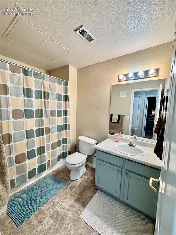 3748 Riviera Grove, Unit 203 Colorado Springs, CO 80922 - Photo 14 of 23 a bathroom with a sink toilet and shower