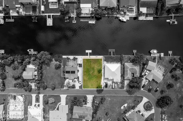an aerial view of a house with a swimming pool