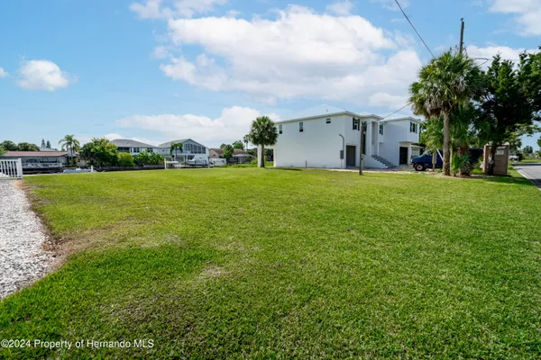 a view of a swimming pool and a yard