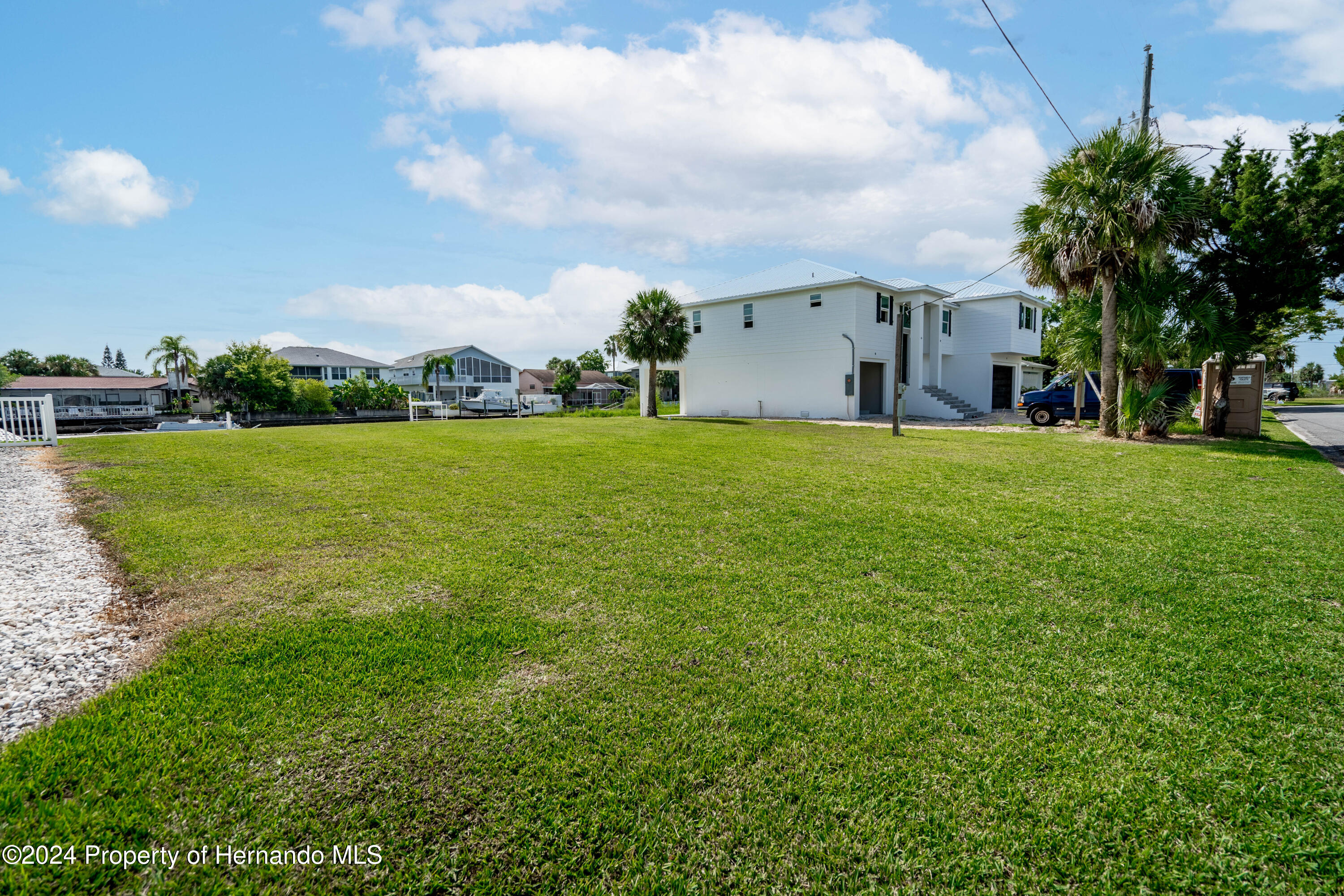 4530 Gulfstream Weeki Wachee, FL 34607 - Photo 16 of 22 a view of a big yard with plants and a large tree