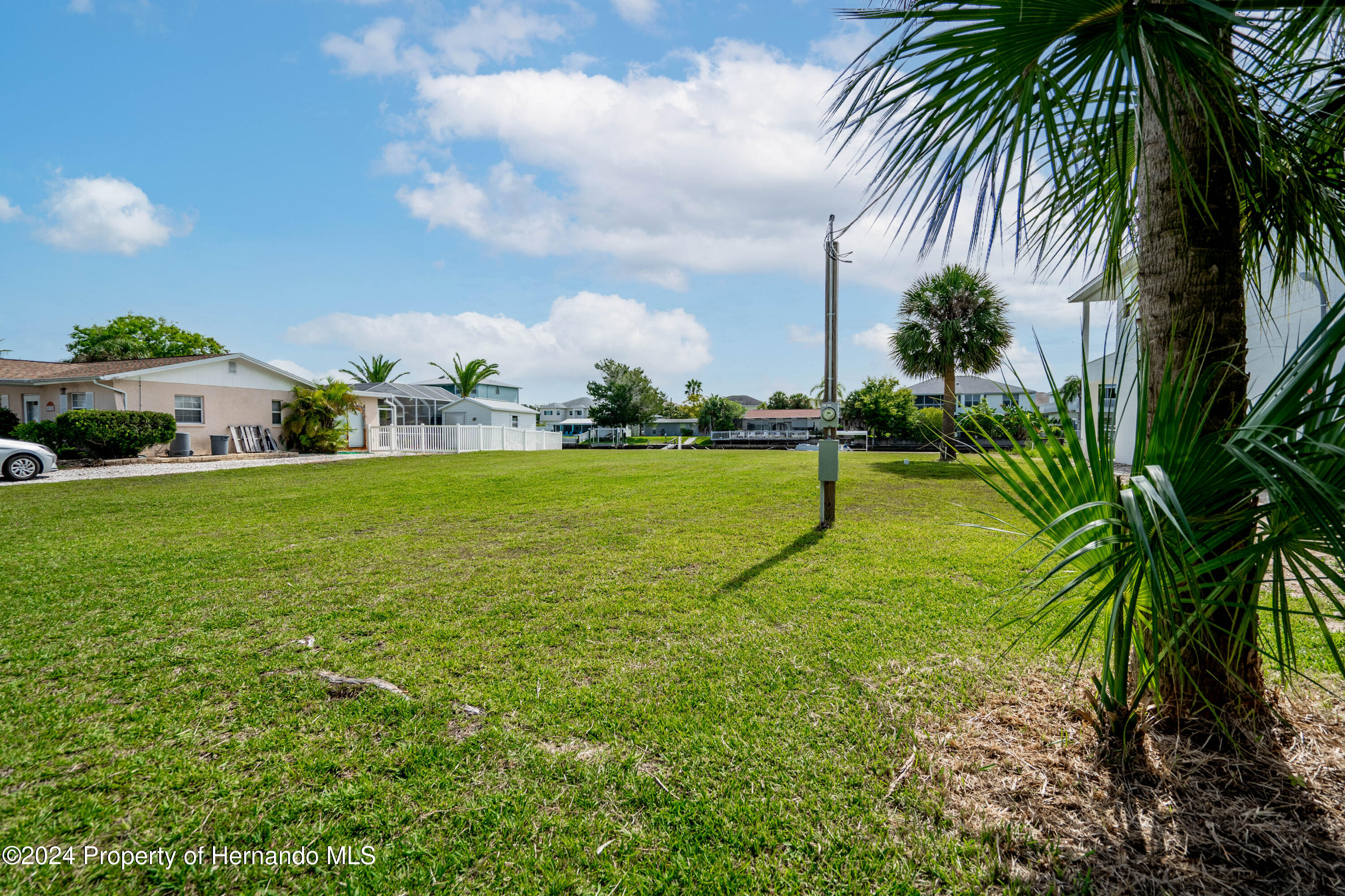 4530 Gulfstream Weeki Wachee, FL 34607 - Photo 17 of 22 a view of a swimming pool and a yard