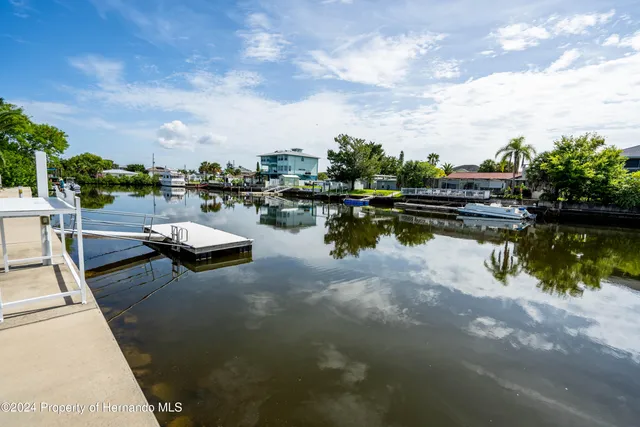 a view of boats and a lake view