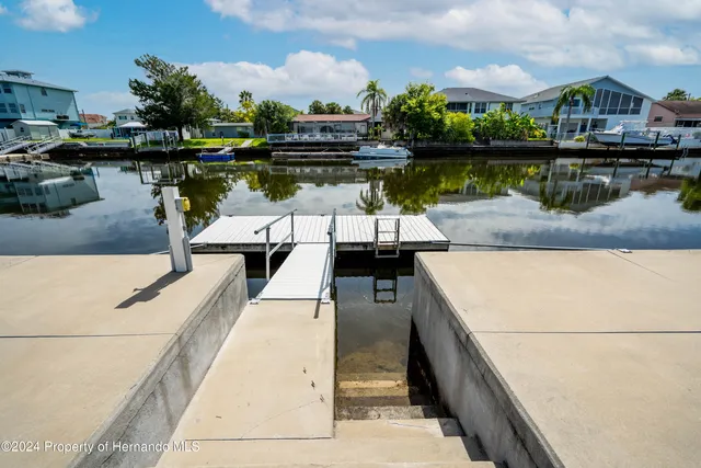 a view of a swimming pool with a lake view