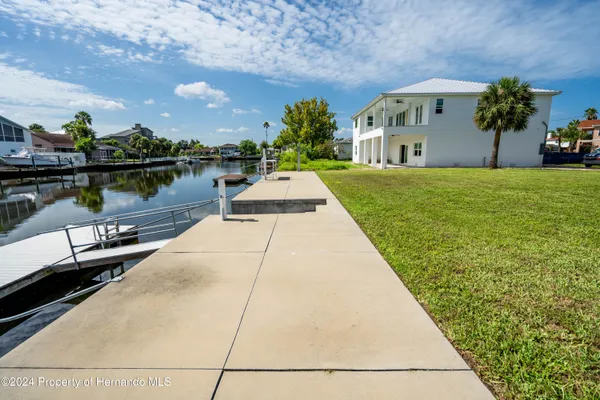 a view of a lake with outdoor seating