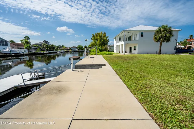 a view of a lake with outdoor seating