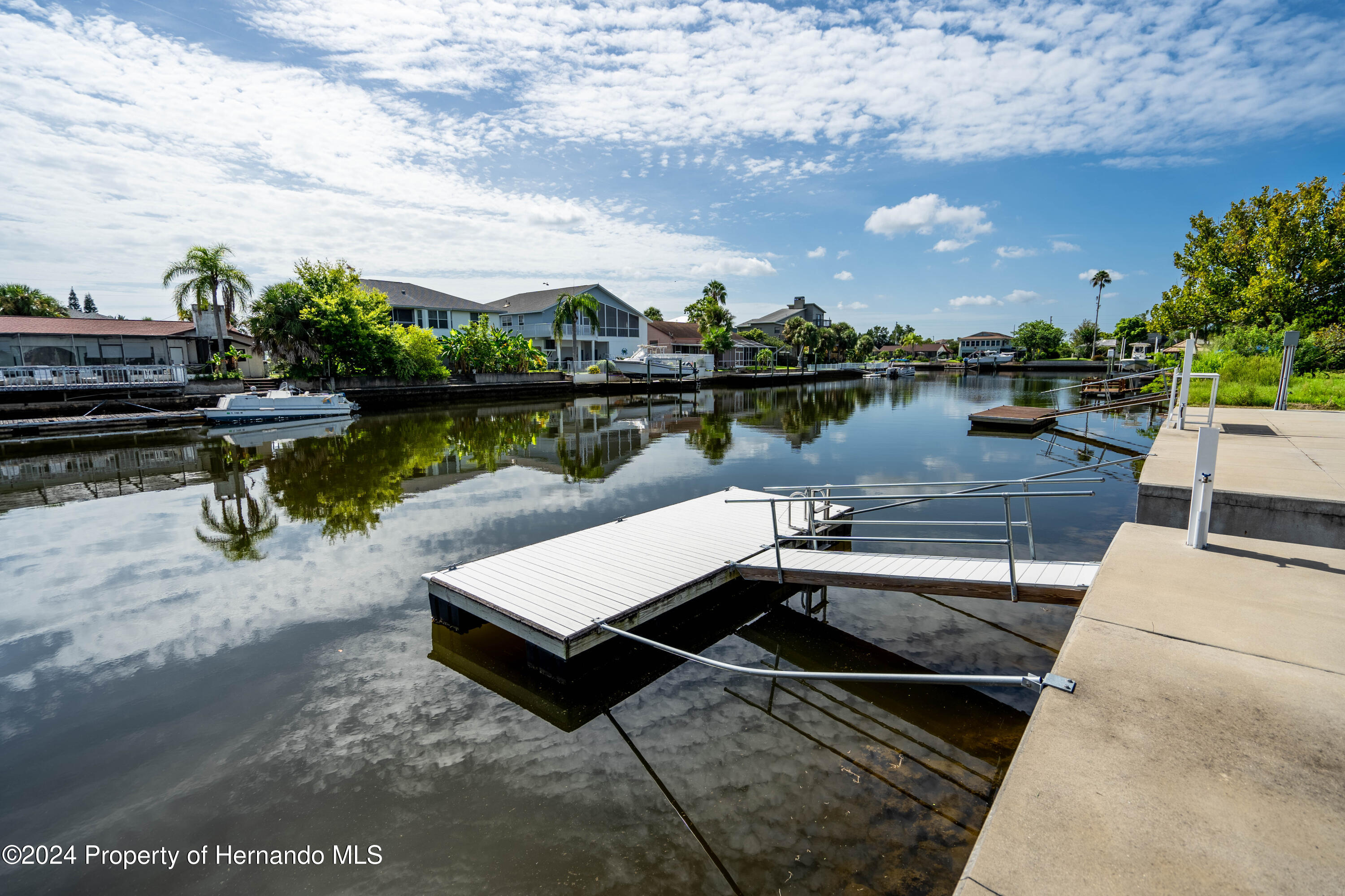 4530 Gulfstream Weeki Wachee, FL 34607 - Photo 21 of 22 a view of a lake with outdoor seating