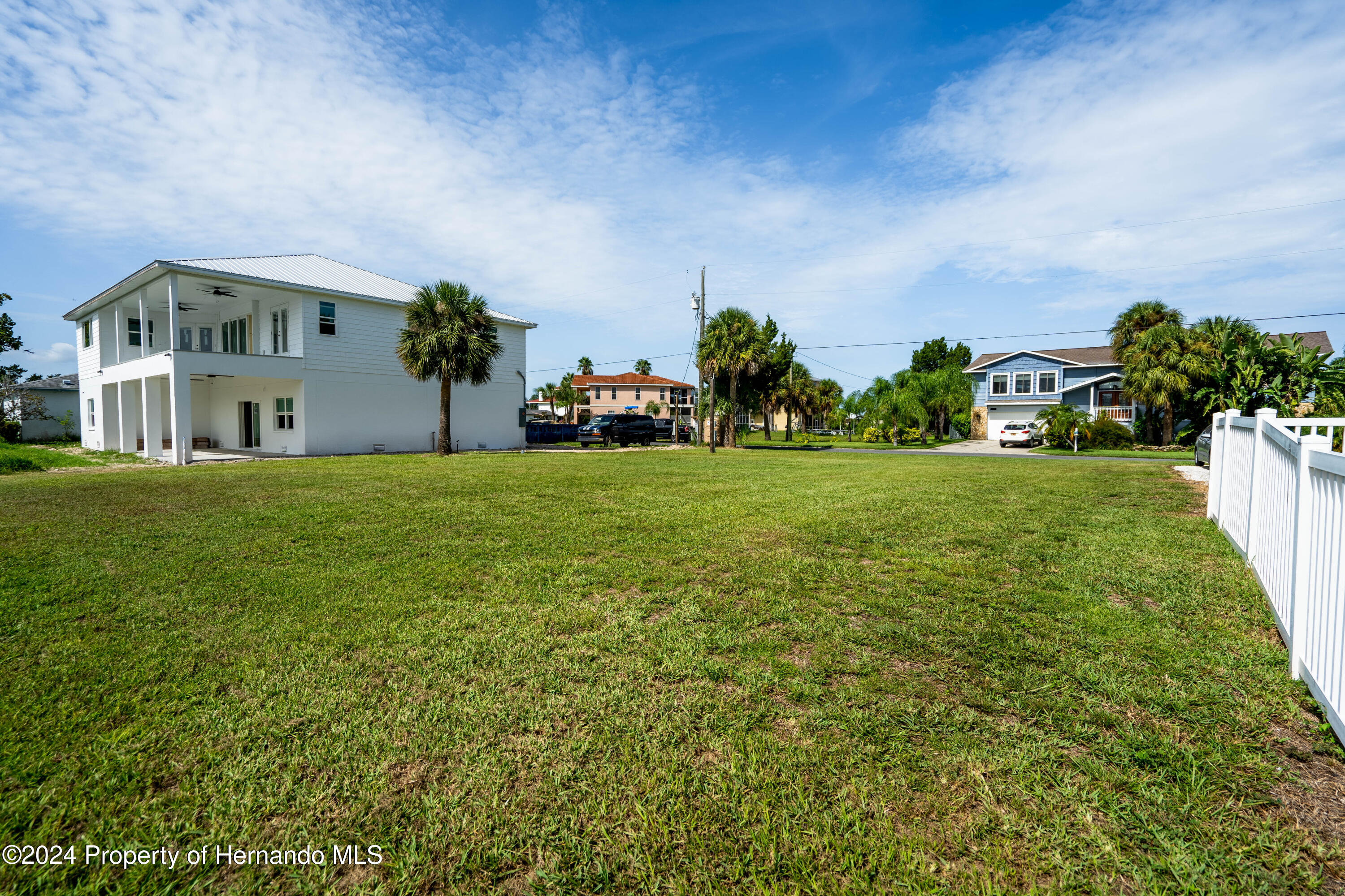 4530 Gulfstream Weeki Wachee, FL 34607 - Photo 22 of 22 a view of a house with a big yard and large trees