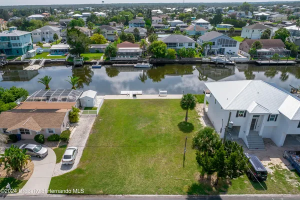 an aerial view of a house with a lake view