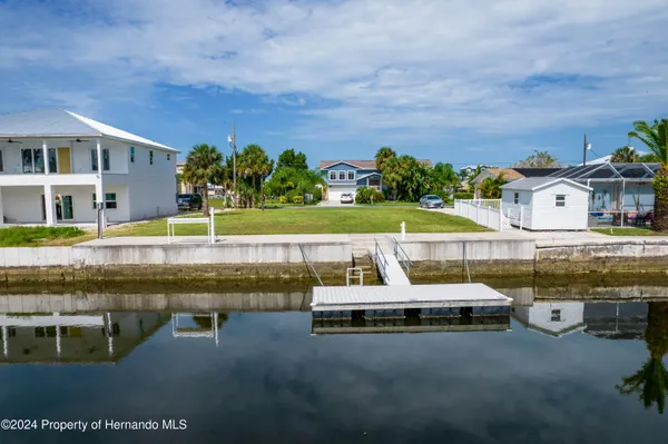 a swimming pool with barbeque oven