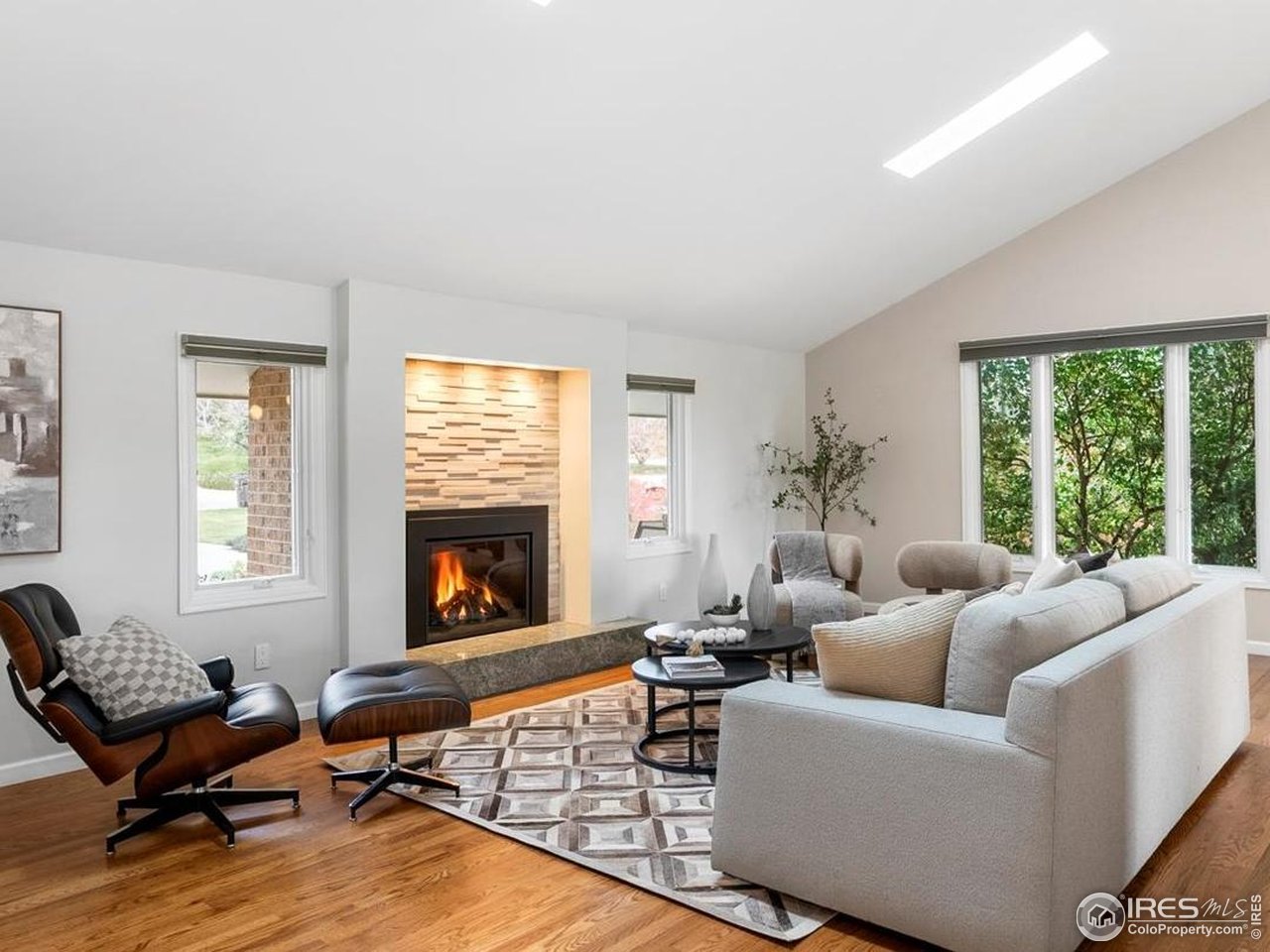 6972 Roaring Fork Trail Boulder, CO 80301 - Photo 1 of 35 a living room with furniture fireplace and window