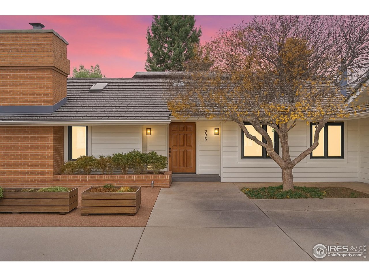6972 Roaring Fork Trail Boulder, CO 80301 - Photo 11 of 35 a front view of a house with a yard