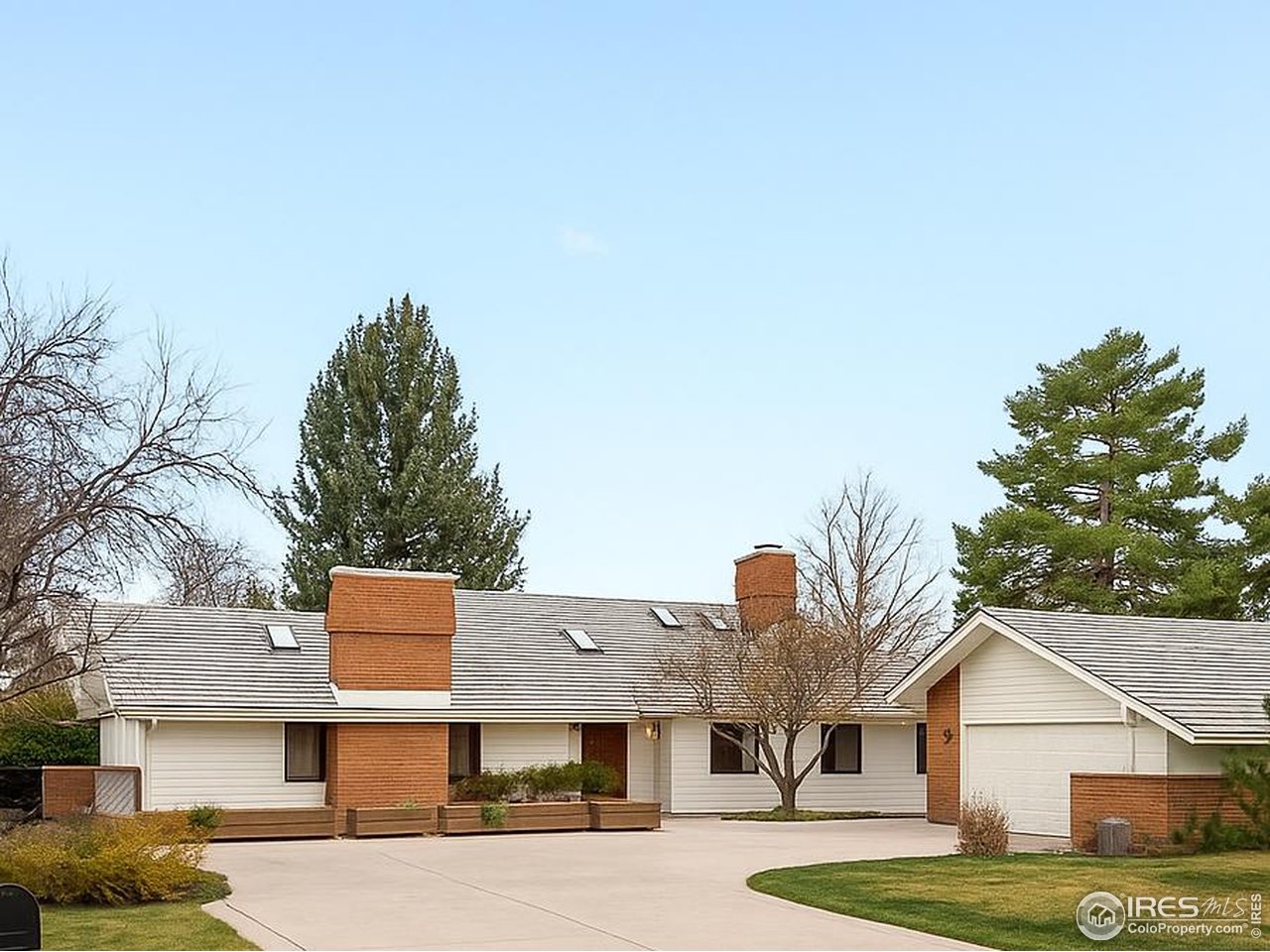 6972 Roaring Fork Trail Boulder, CO 80301 - Photo 12 of 35 a front view of a house with a yard