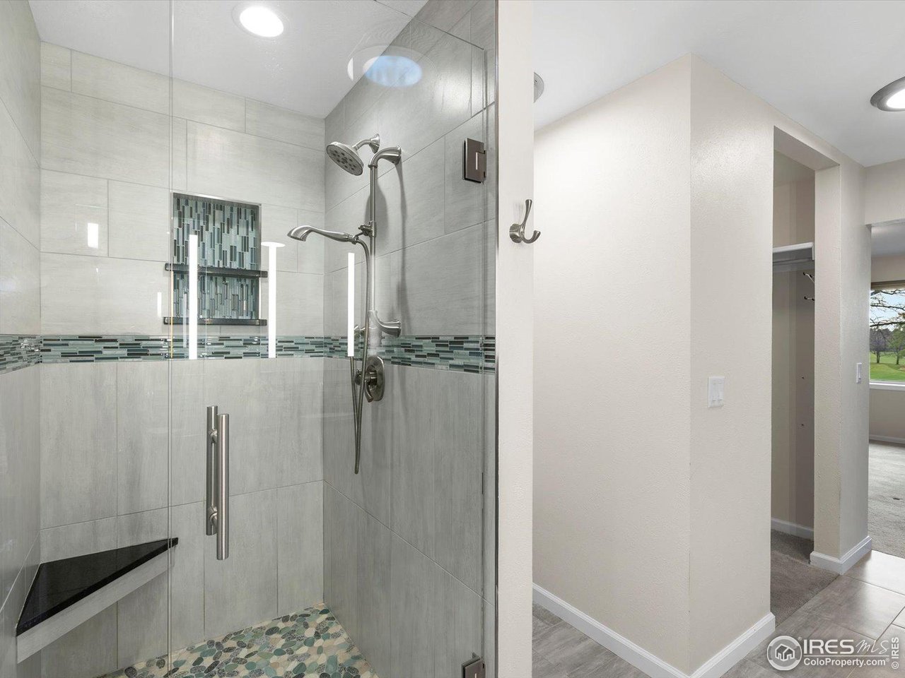 6972 Roaring Fork Trail Boulder, CO 80301 - Photo 17 of 35 a bathroom with a shower and a sink