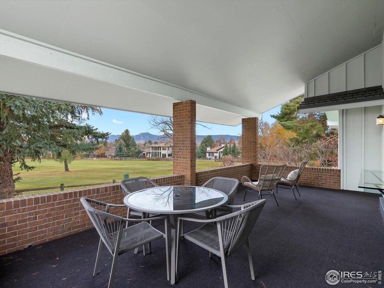 6972 Roaring Fork Trail Boulder, CO 80301 - Photo 23 of 35 a view of an outdoor dining space with furniture and garden view
