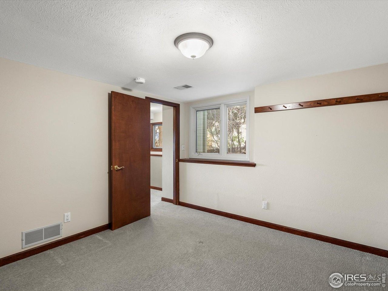 6972 Roaring Fork Trail Boulder, CO 80301 - Photo 26 of 35 a view of an empty room with a window