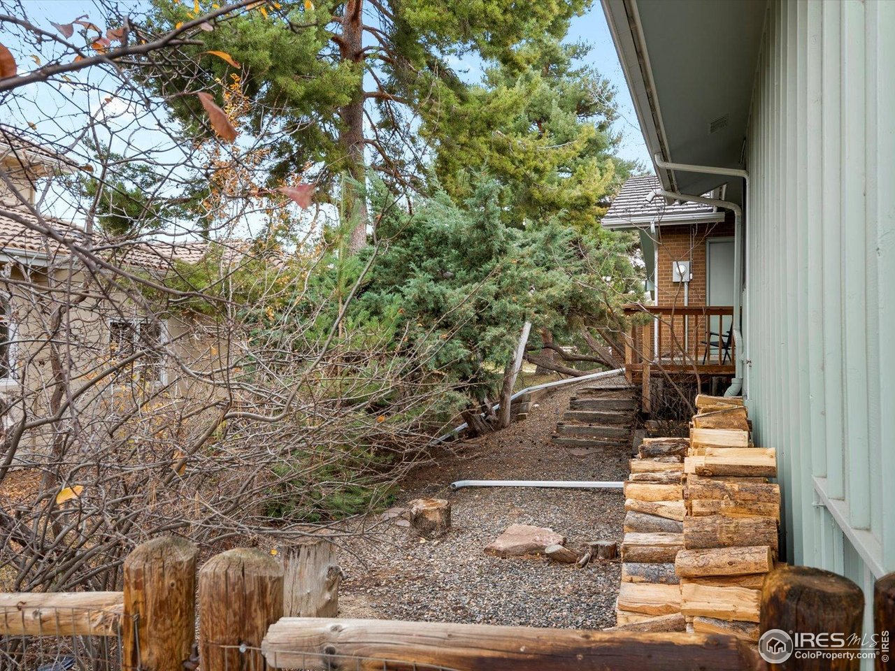 6972 Roaring Fork Trail Boulder, CO 80301 - Photo 30 of 35 a view of a yard with couches and wooden floor