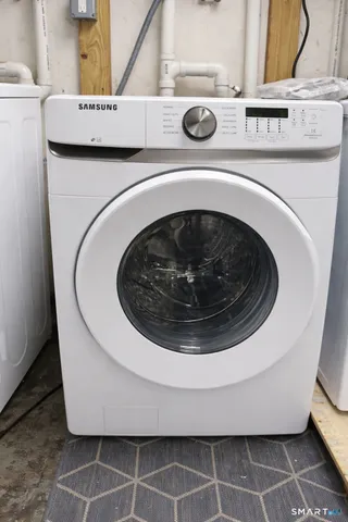 a utility room with a washing machine