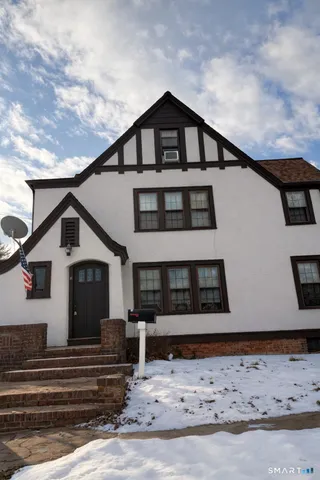 a front view of a house with garage