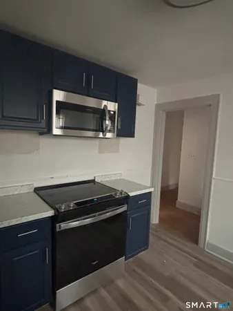 a kitchen with a stove and a microwave