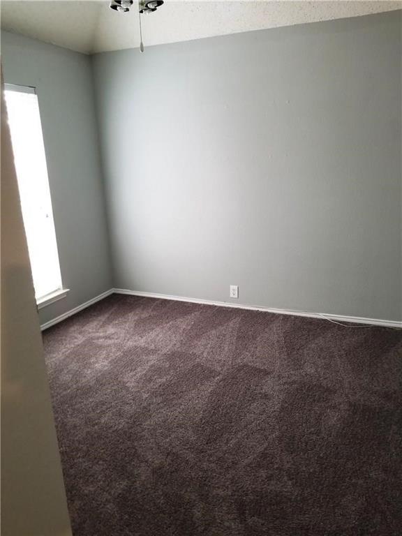 1100 Raleigh Drive Lewisville, TX 75077 - Photo 14 of 19 an empty room with a window