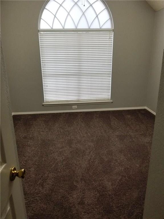 1100 Raleigh Drive Lewisville, TX 75077 - Photo 15 of 19 an empty room with a window