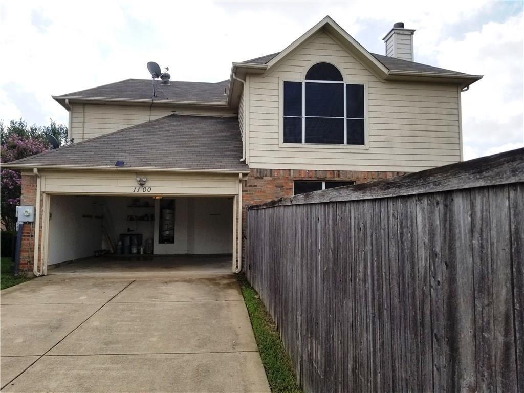 1100 Raleigh Drive Lewisville, TX 75077 - Photo 19 of 19 a view of a house with a garage and yard
