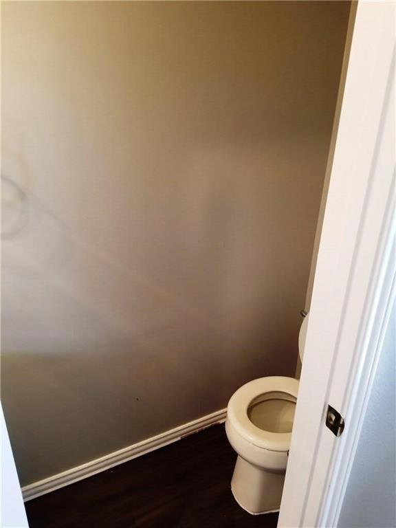 1100 Raleigh Drive Lewisville, TX 75077 - Photo 9 of 19 a bathroom with a toilet and a sink