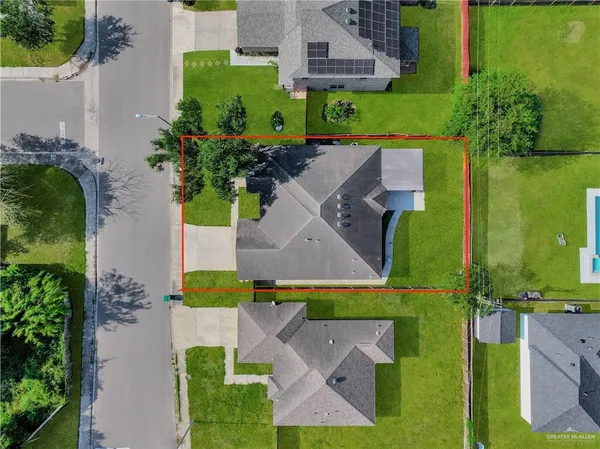 an aerial view of a house with a garden