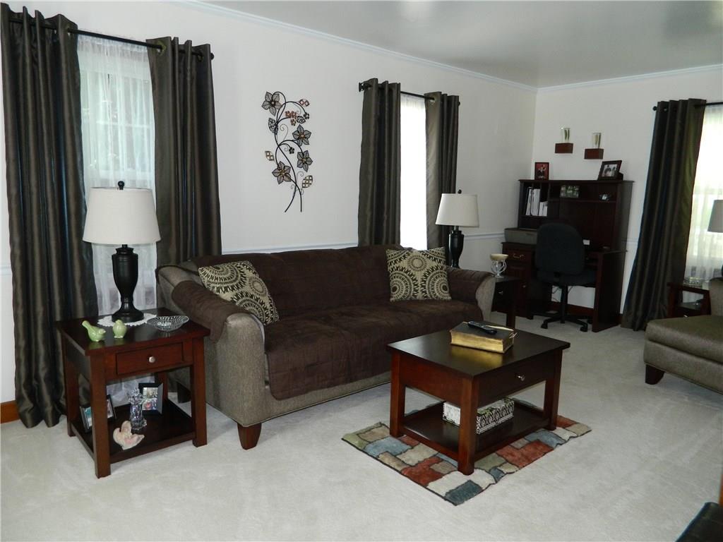 516 Franklin Farms Road Washington, PA 15301 - Photo 8 of 25 The living room is very large with four windows for natural light. Neutral carpeting and paint accent the room.
