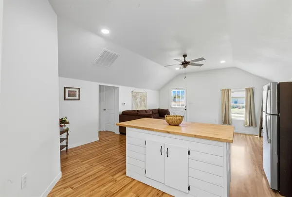 a kitchen with a sink and a refrigerator