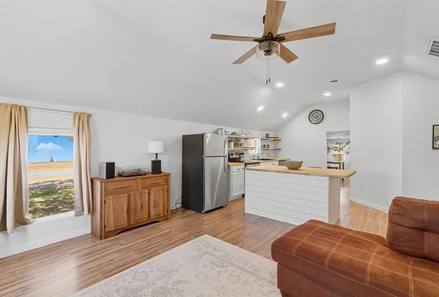 a kitchen with cabinets and stainless steel appliances